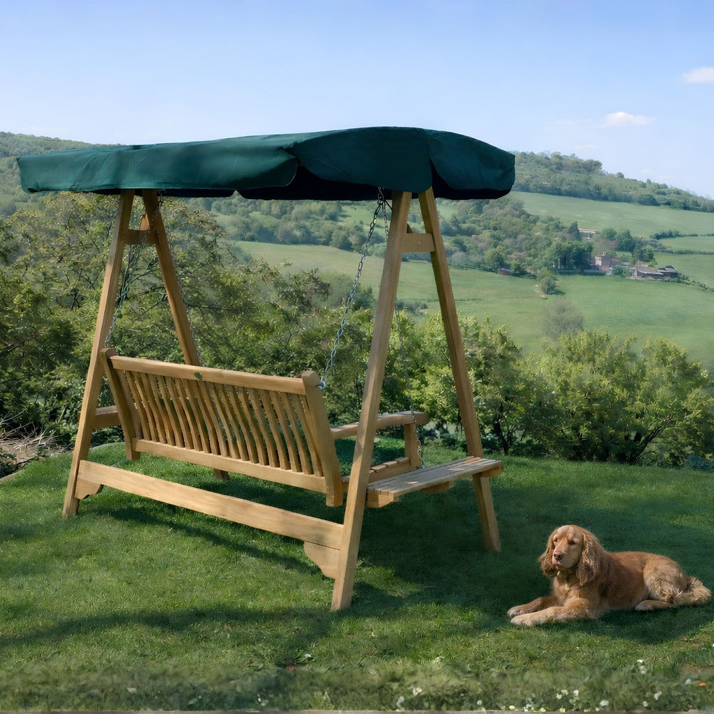 Chic Teak teak garden swing seat with green canopy overlooking the countryside