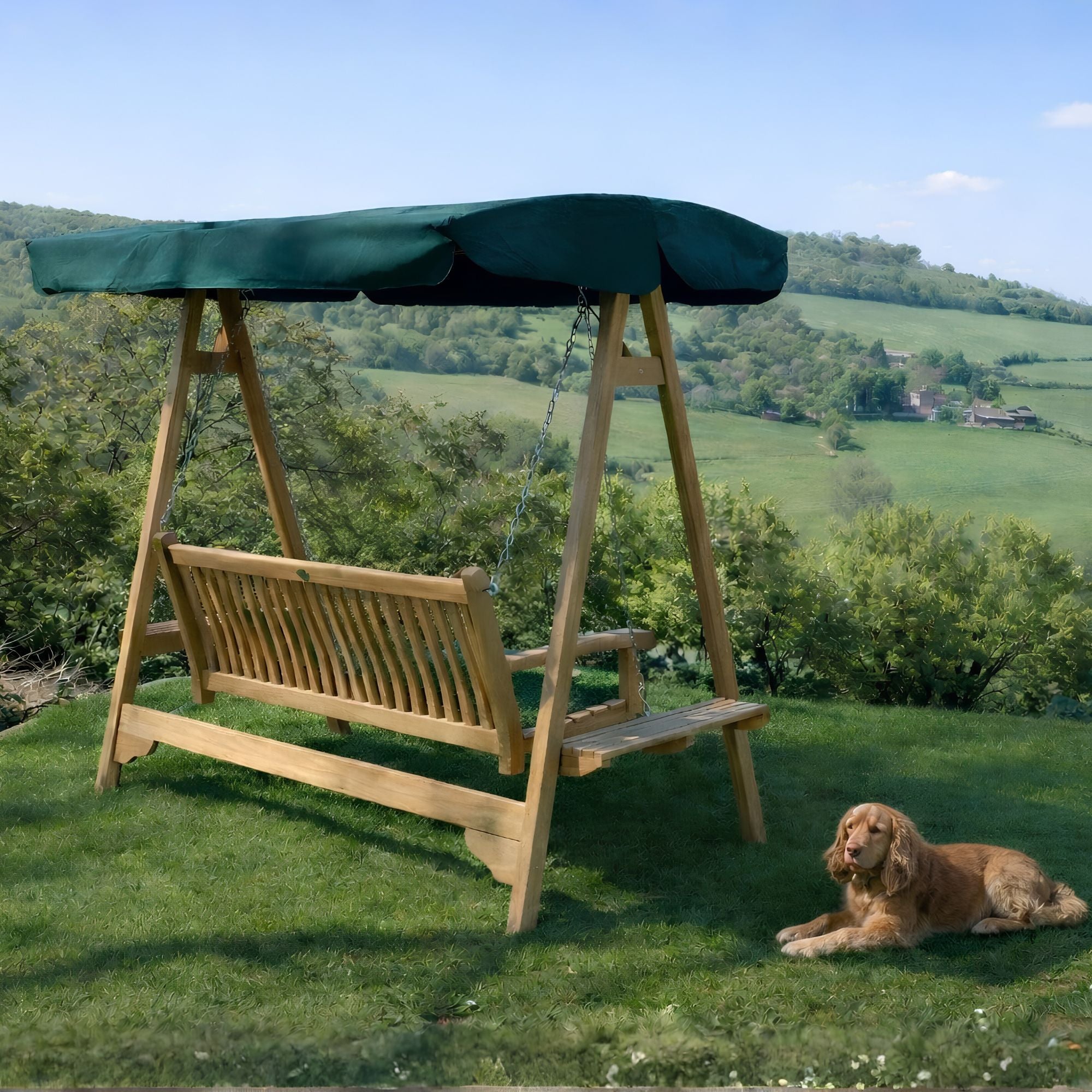 Chic Teak teak garden swing seat with green canopy overlooking the countryside