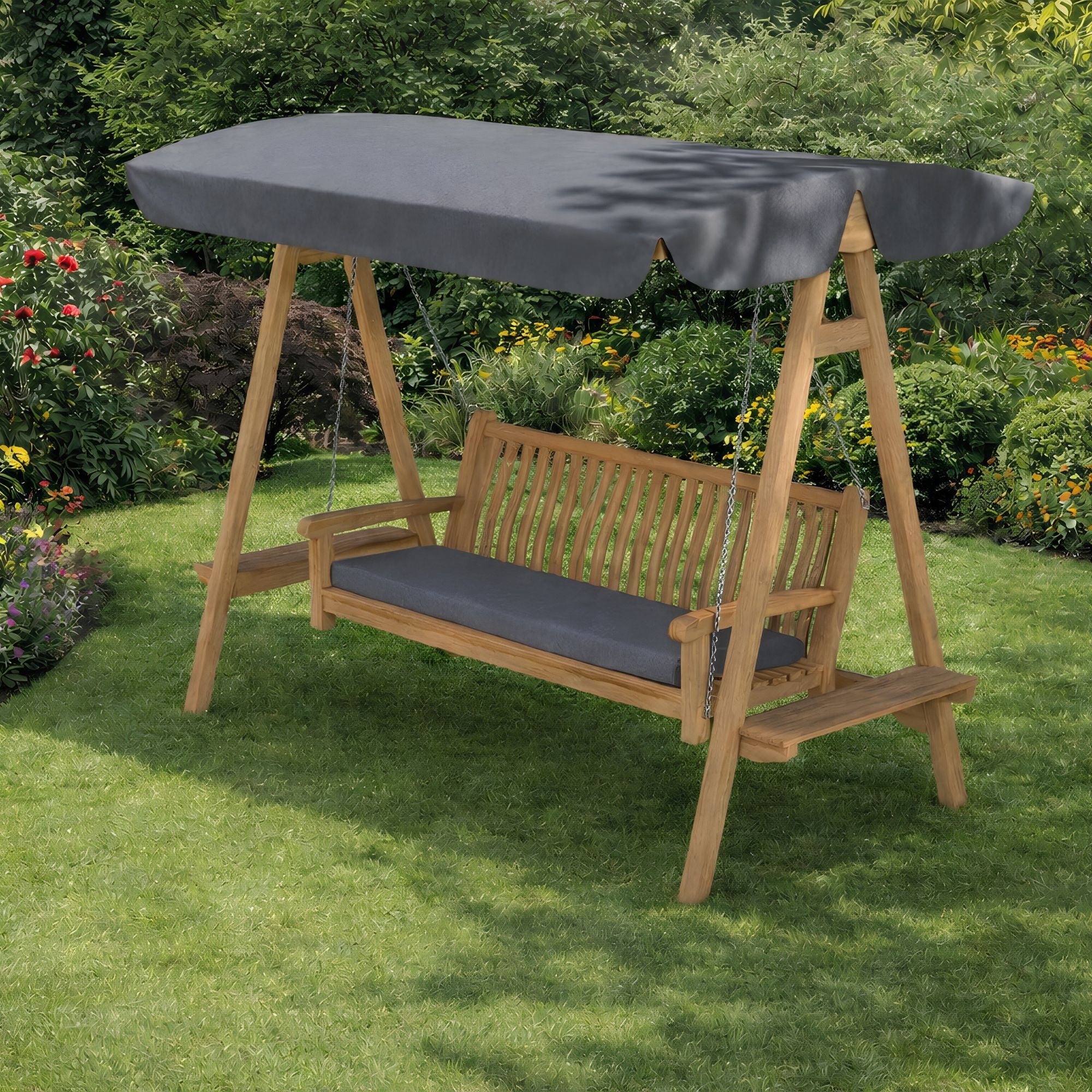Chic Teak outdoor teak swing seat with charcoal grey canopy on a garden lawn