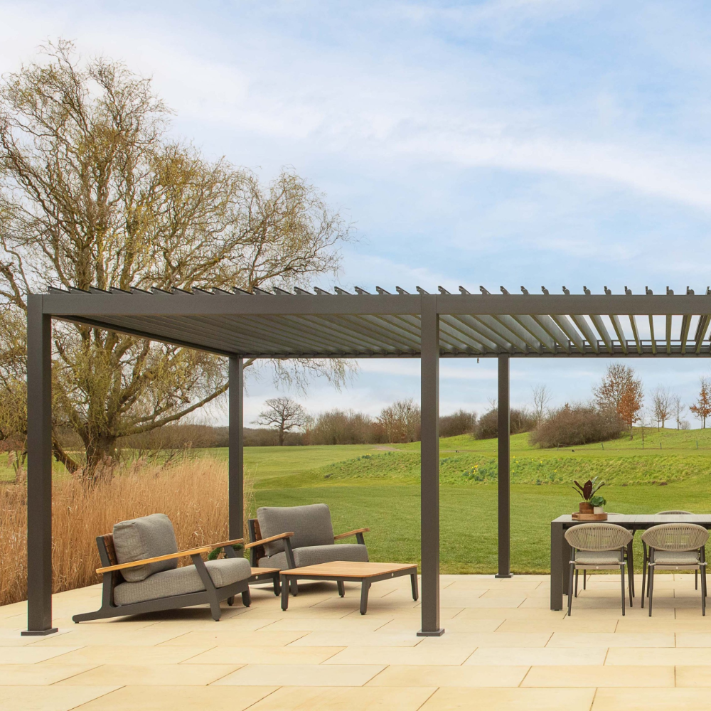 Suns Lifestyle Alvaro Louvered Pergola Black Outdoor Open Roof With Sofa and Dining Table