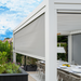 Suns Lifestyle Alvaro Louvered Pergola White Outdoor With DIning Table Half Screen Down